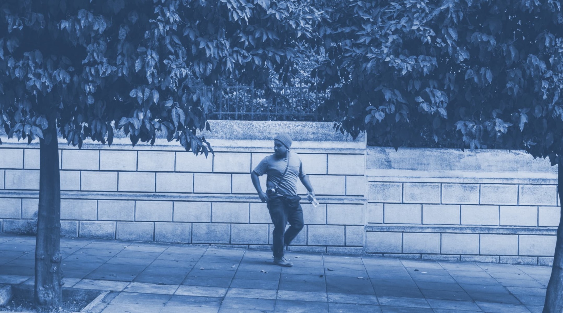 a man outdoors on a sidewalk