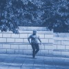 a man outdoors on a sidewalk