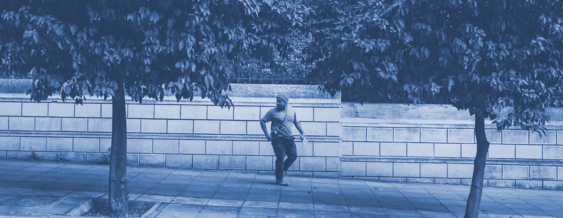 a man outdoors on a sidewalk