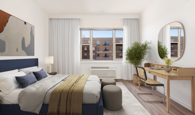bedroom with ample space around the bed and bright lighting