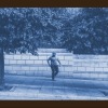 a person standing on a sidewalk