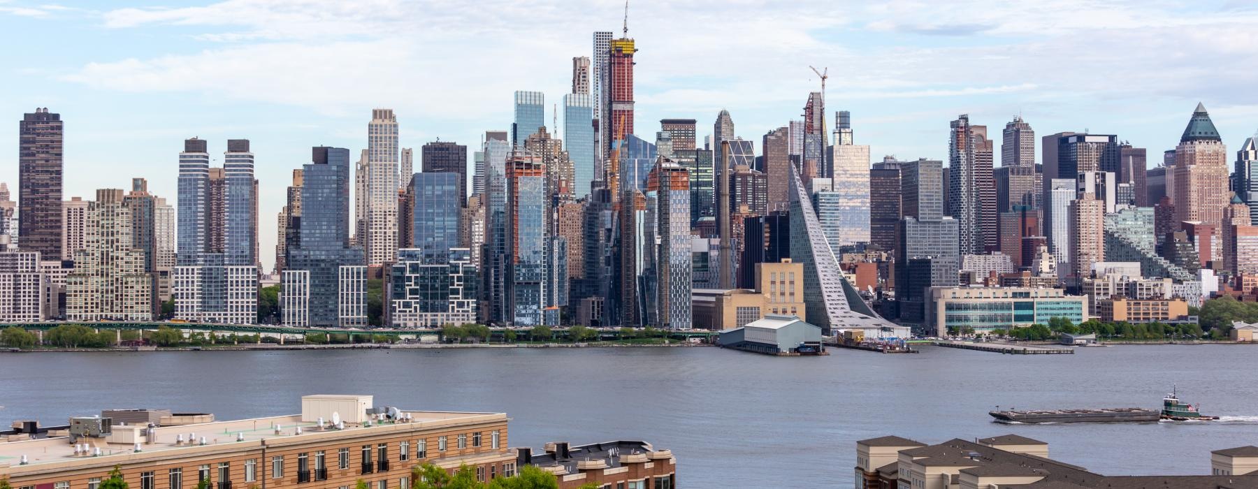 a city skyline with a river