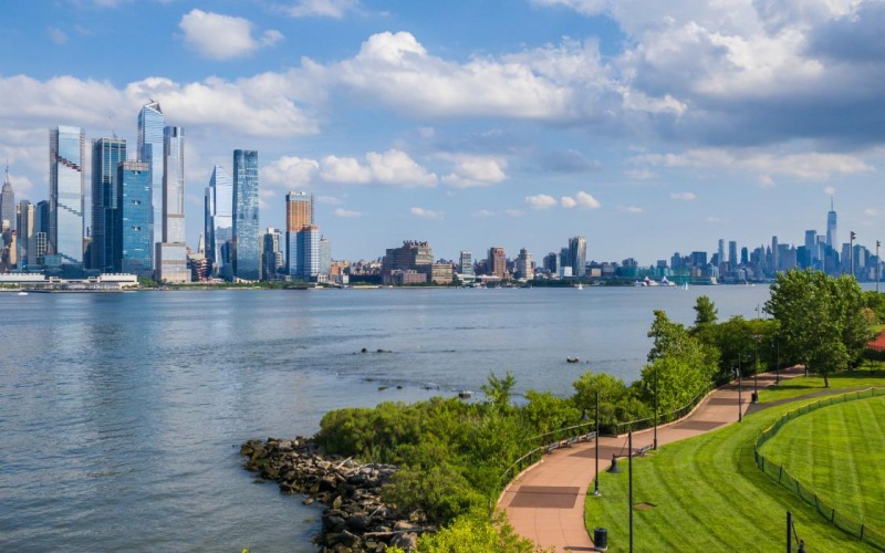 a city skyline across a body of water