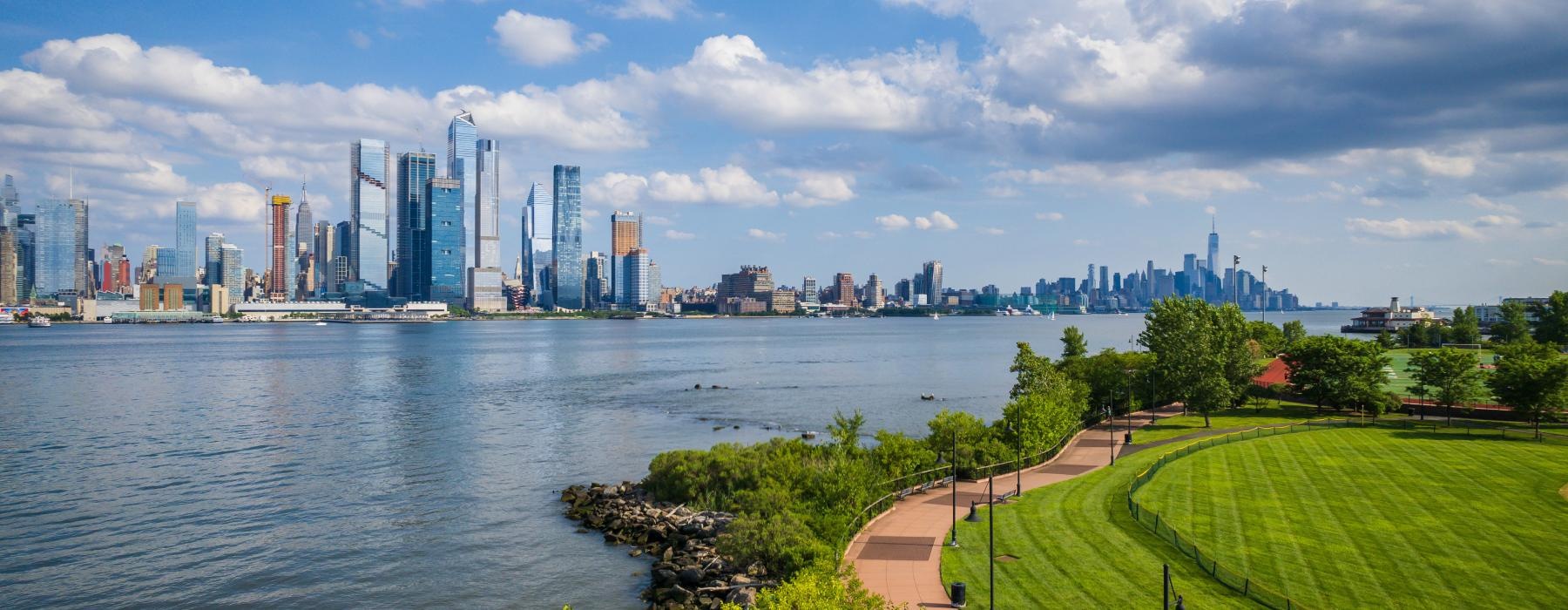 a city skyline across a body of water