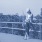 a girl sitting on a fence