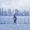 a man running in front a city