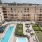 a pool in a courtyard between buildings