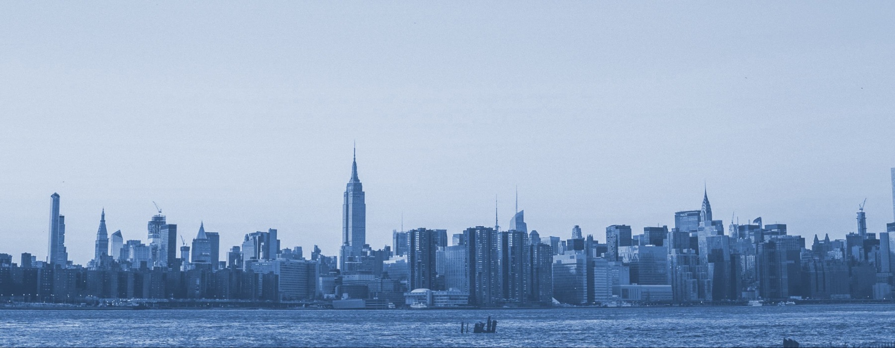 a city skyline with a river
